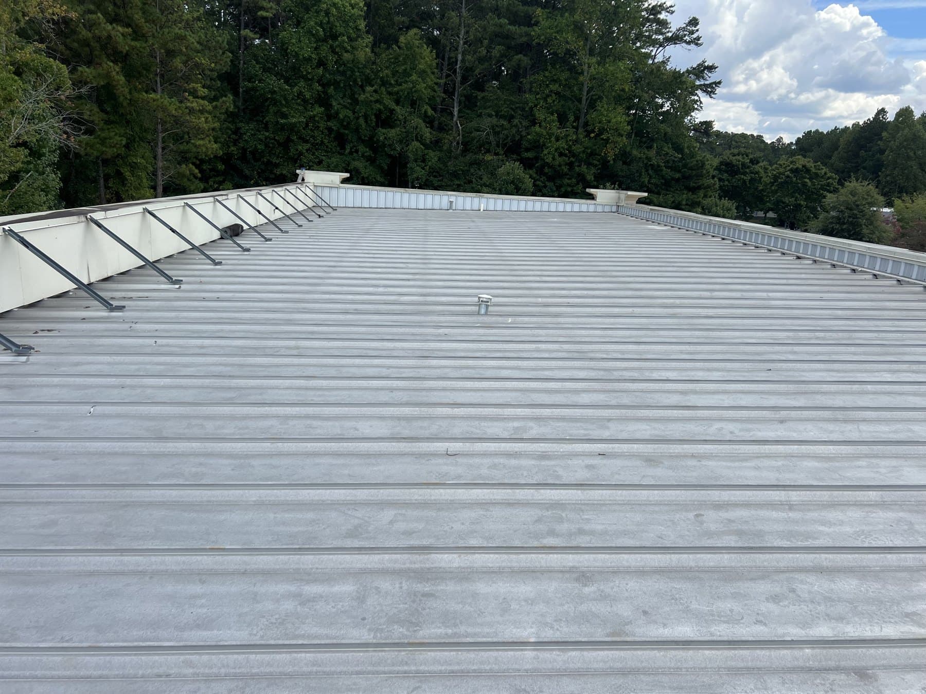 A standing-seam metal roof installed by Bailey on a North Georgia property