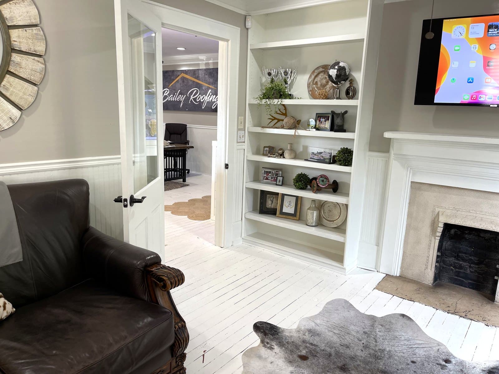 Styled living room remodel with a fireplace and custom built-in shelving