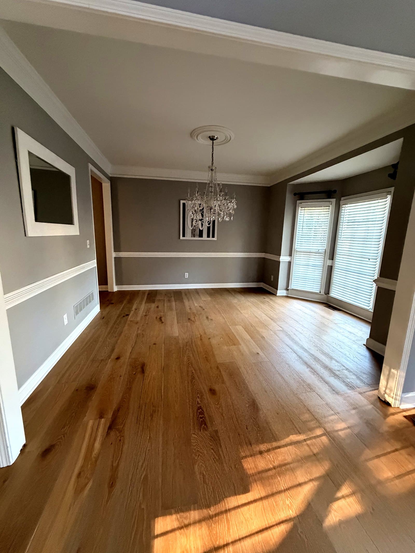 Interior restored with fresh paint, trim, and refinished hardwood floors