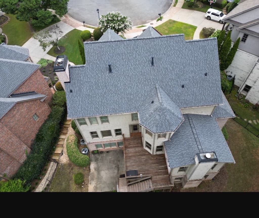 Drone view of a completed architectural-shingle roof replacement